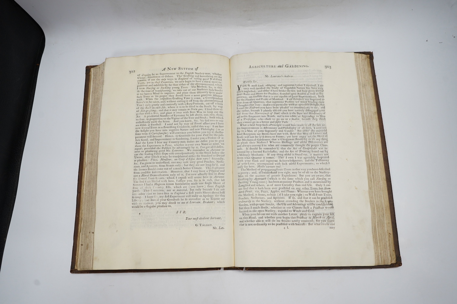 Laurence, John - A New System of Agriculture. Being a complete body of husbandry and gardening....1st edition. frontis. 2 plates, engraved text illus., head and tailpiece decorations; contemp. blind decorated panelled ca